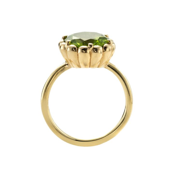 A vivid green peridot. This gem displays glorious chartreuse tone and is set in scalloped bezel on a minimalist band. The ring showcases the glorious  beauty of this magical stone, which happens to be the first gemstone to be discovered on Mars! It is a round flower-cut, measuring 10mm in diameter and is custom cut for Elegant Peridot Birthstone Ring With Prong Setting, Timeless Green Diamond Round Ring, Timeless Green Round Band Jewelry, Timeless Green Jewelry With Bezel Setting, Elegant Green Birthstone Ring With Bezel Setting, Green Diamond Ring With Bezel Setting, Green Diamond Ring With Bezel Setting, Round Cut, Peridot Ring With Prong Setting In Round Cut, Green Diamond Ring With Bezel Setting In Round Cut