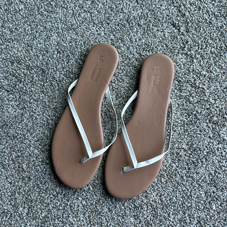 Nwot! Size 10. White Casual Flip Flops With Flat Heel, Casual White Flip Flops, White Synthetic Sandals With Single Toe Strap, White Synthetic Sandals For Beach Season, White Slip-on Sandals For Beach Season, White Toe Post Sandals For Spring, White Toe Post Summer Sandals, White Flat Heel Sandals For Beach Season, Trendy White Toe Post Sandals