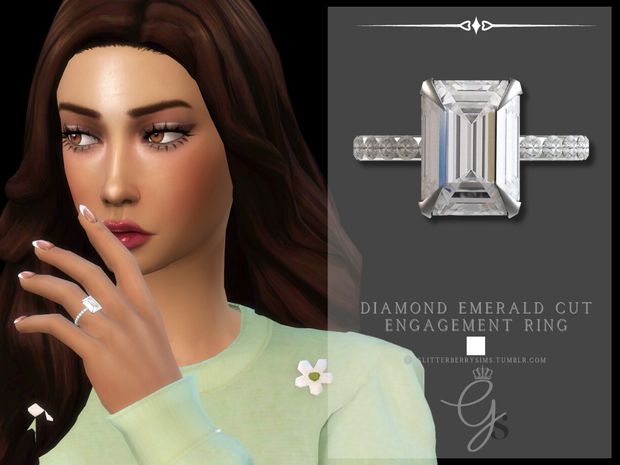 a woman with long brown hair wearing a ring and diamond emerald cut engagement ring in front of her face