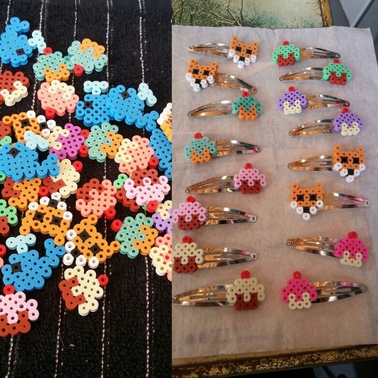 there are several different types of hair clips on the table and one is made out of plastic beads