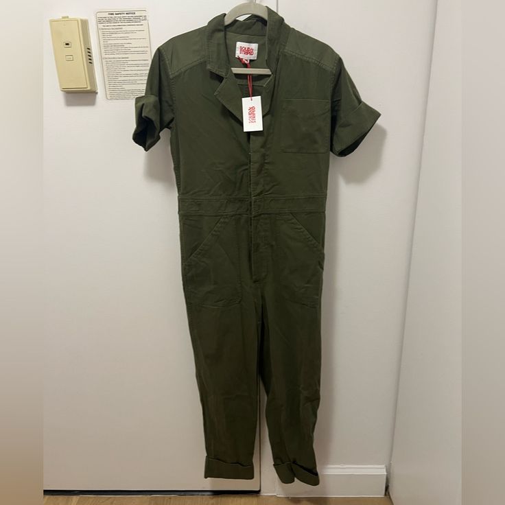 Size: Small Color: Army Green Condition: New With Tags Inseam: 26.5" Bust: 38" Low Hip: 39" Content: 100% Cotton Garment Made In China Handle With Care Fitted Green Overalls, Fitted Short Sleeve Overalls For Workwear, Fitted Utility Overalls In Solid Color, Fitted Solid Color Utility Overalls, Solid Color Fitted Utility Overalls, Fitted Green Overalls With Pockets, Fitted Green Overalls For Workwear, Fitted Green Cotton Overalls, Handle With Care