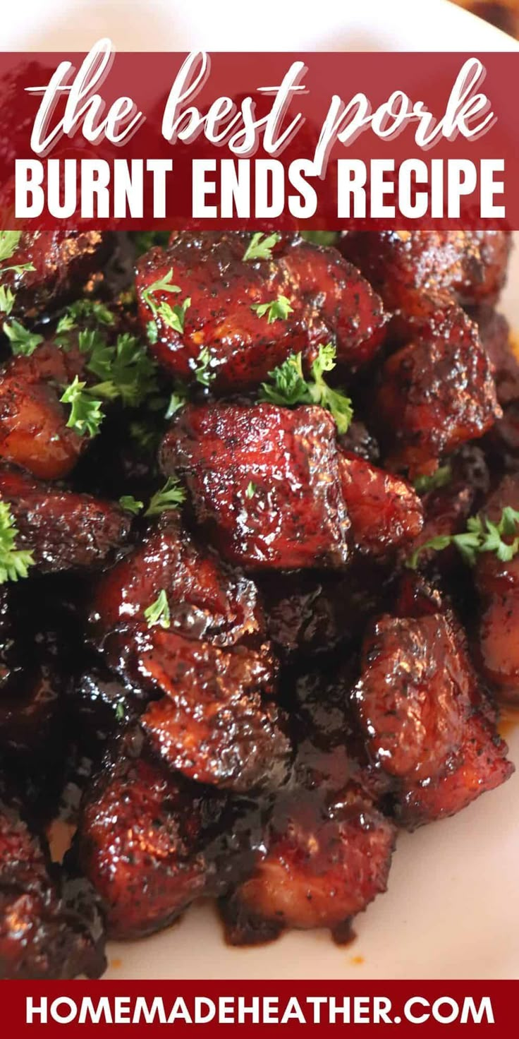 the best pork burnt ends recipe on a white plate with red sauce and parsley