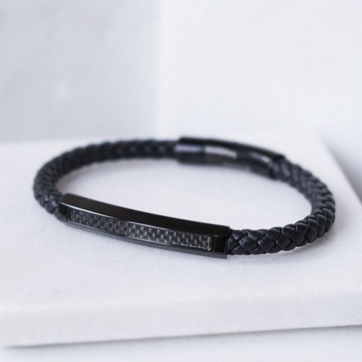 Mens Bracelet Black genuine leather bracelet with a Stainless Steel base, Carbon Fiber plate. Includes a secure stainless steel clasp for secured closure. Product Details Width: 6mm (0.24”) Finish: Matte Modern Stainless Steel Braided Bracelets For Everyday, Modern Black Braided Bracelets For Everyday, Modern Black Braided Bracelet For Everyday, Minimalist Adjustable Braided Bracelet With Stainless Steel Clasp, Minimalist Black Braided Bracelet With Stainless Steel Clasp, Black Rectangular Leather Jewelry, Black Leather Rectangular Jewelry, Modern Black Stainless Steel Wristband, Everyday Black Braided Bracelet With Leather Strap