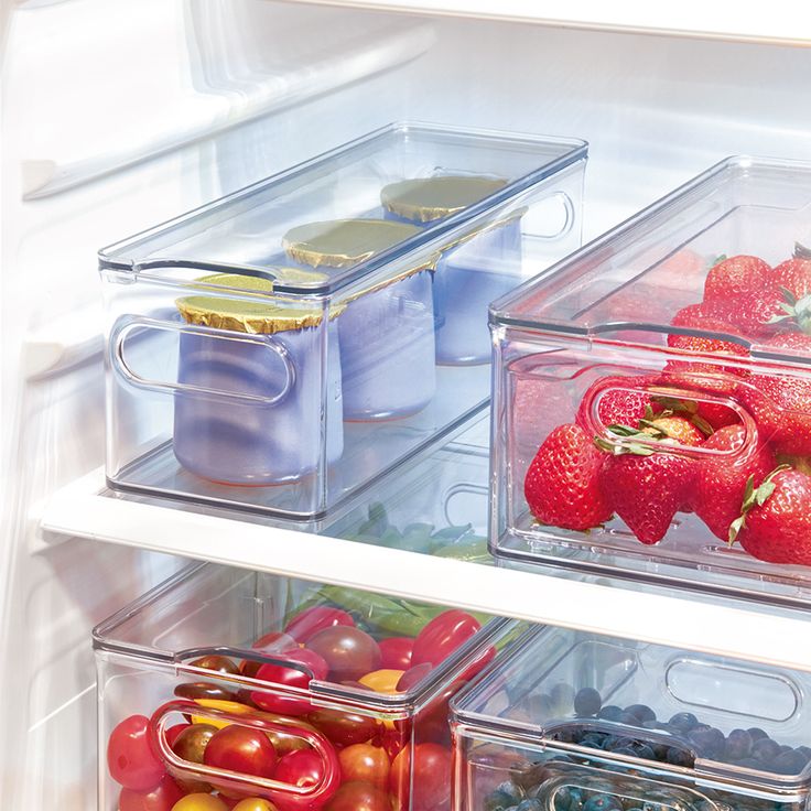 an open refrigerator filled with lots of different types of fruits and veggies in containers