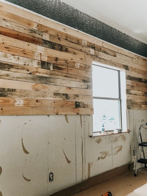 a room that has some wood on the wall