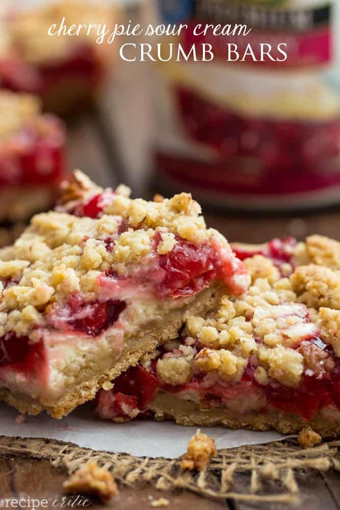 cherry pie sour cream crumb bars are stacked on top of each other and ready to be eaten