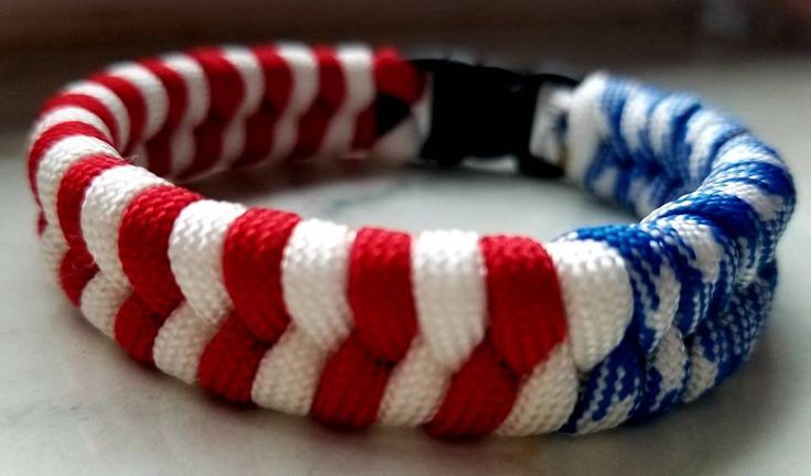 a red, white and blue bracelet on a table