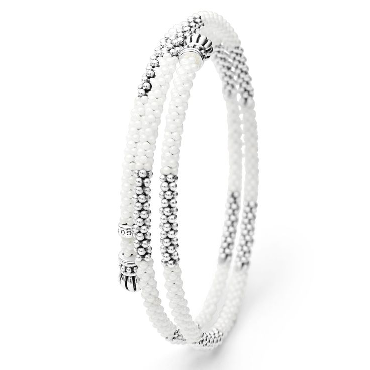 Ten sterling silver stations highlighted by white ceramic Caviar beading finished with fluted sterling silver endcaps form this coil bracelet. Adjustable White Bracelet With Sterling Silver Clasp, Adjustable Sterling Silver Bracelet With Silver Beads, Adjustable White Sterling Silver Bracelet With Silver Beads, White Sterling Silver Jewelry With Spacer Beads, White Sterling Silver Bracelets With Spacer Beads, Sterling Silver Bracelets With White Spacer Beads, White Sterling Silver Bracelet With Round Beads, Sterling Silver Beaded White Bracelet, White Beaded Sterling Silver Bracelet