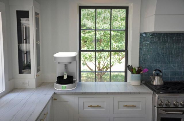 a kitchen with an oven, stove and sink in it's center island next to a window