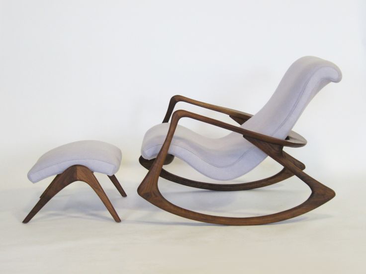 a rocking chair and ottoman with white fabric