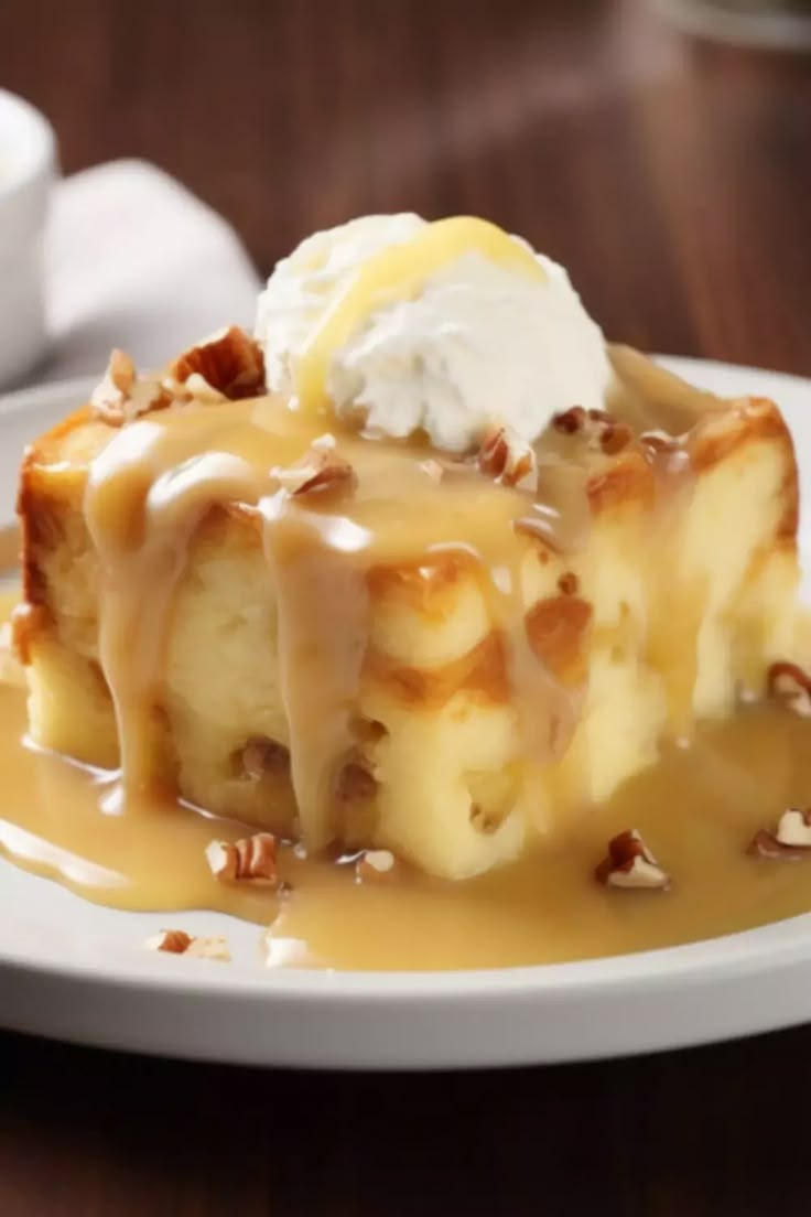 a piece of cake with ice cream and caramel drizzled on top