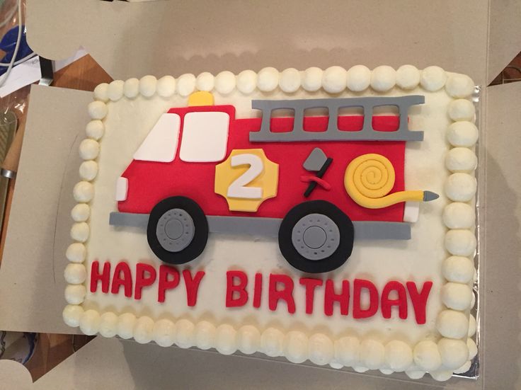 a birthday cake that is shaped like a fire truck