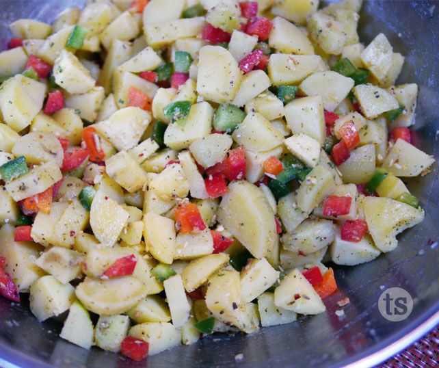 a bowl filled with chopped vegetables on top of a table