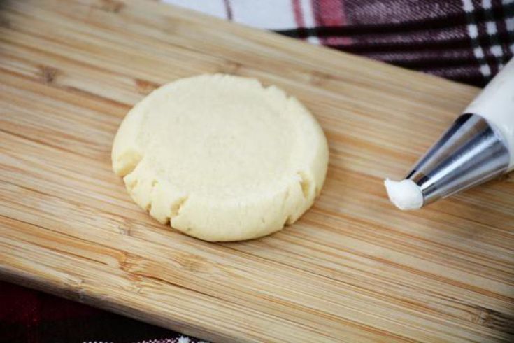 a wooden cutting board with a pastry on it