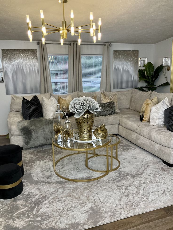 a living room filled with furniture and a chandelier