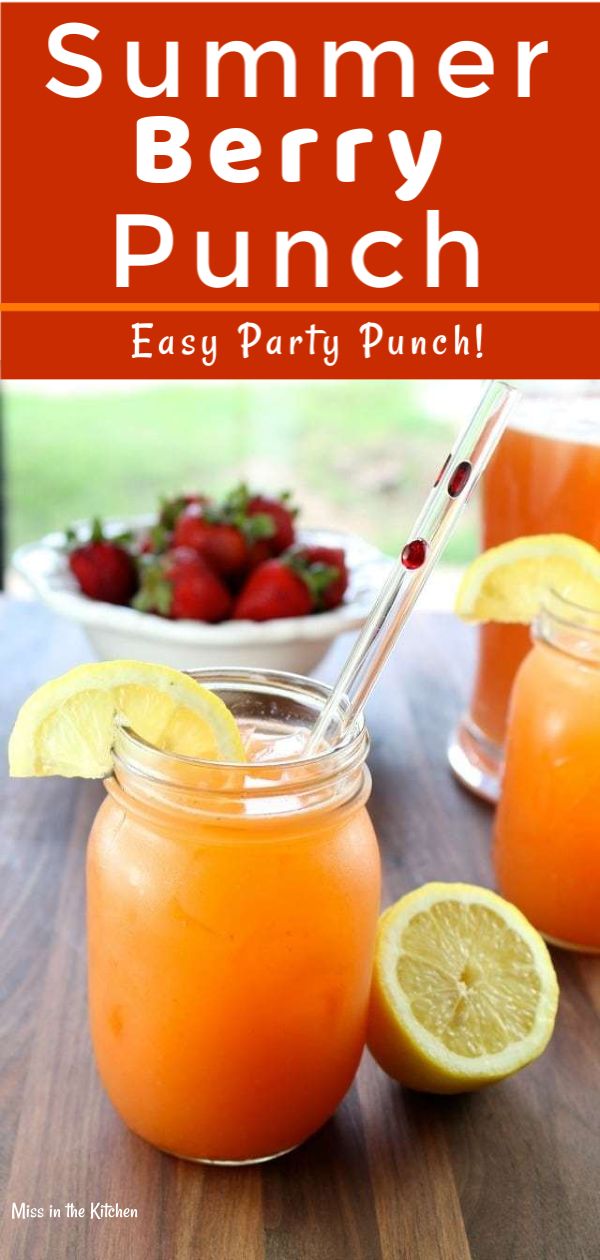 two mason jars filled with orange juice and strawberries