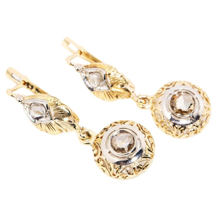 In a setting of ribboning 14 carat gold, as though patterned from leaves, The Willow Drop Earrings are a delightful whimsy. Her rose cut diamonds sit in a frame of white gold, a rich and abiding treasure for generations to come. The Willow Earrings Gem Details The modern rose cut diamonds are estimated to total approximately 0.22 carats with M colour and P1 clarity grades. The drop sections each hold a 4.50 millimetre round modern rose cut diamond estimated to weigh 0.40 carats, are M to N colou Diamond Drops, Style Earrings, Rose Cut Diamond, Vintage Jewellery, Free Jewelry, Rose Cut, Jewelry Pieces, Diamond Cuts, Jewelry Design