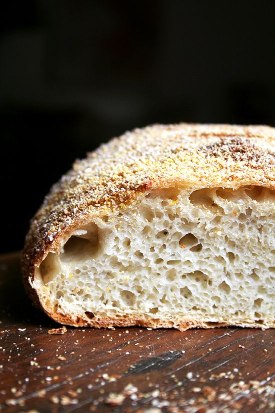 a loaf of bread sitting on top of a wooden table