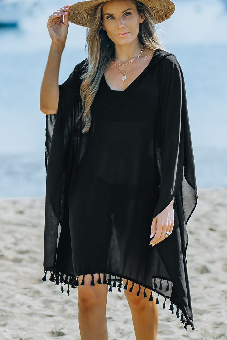 Black Tassel Hooded Oversized Beach Cover Up Casual Vacation Cover-up With Tassels, Black Long Sleeve Poncho For Beach, Black Long Sleeve Beach Poncho, Black Poncho For Summer, Black Bohemian Poncho For Summer, Black Long Sleeve Summer Cover-up, Bohemian Black Summer Poncho, Summer Bohemian Black Poncho, Casual Black Summer Poncho