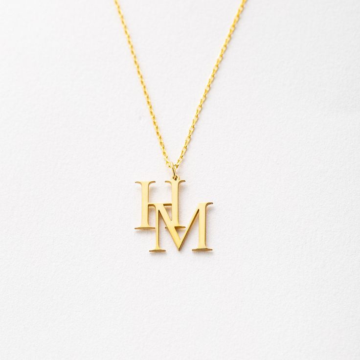 Enjoy the personalized elegance of our Custom Interlocking Letters Necklace. This stunning piece combines beauty and meaning, making it a perfect symbol of your unique story. Whether it's your initials, a loved one's, or a special combination, this necklace is designed to keep your cherished connections close to your heart. Personalized Handmade Jewelry crafted with love.♥♥♥ PRODUCT DETAILS• Material: Solid 925 Sterling Silver• Gold and rose options are plated over solid 925 sterling silver.• Le Elegant Name Necklaces For Anniversary Gift, Elegant Personalized Name Necklace For Anniversary, Elegant Custom Name Necklace For Anniversary, Elegant Personalized Necklace For Anniversary Gift, Minimalist Jewelry With Initials For Anniversary, Elegant Necklaces With Initials For Anniversary, Minimalist Initial Pendant Charm Necklace For Anniversary, Classic Name Pendant Necklace, Minimalist Initial Pendant Charm Necklace For Anniversary Gift