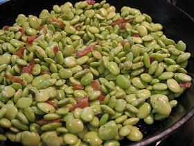 green beans are cooking in a pan on the stove