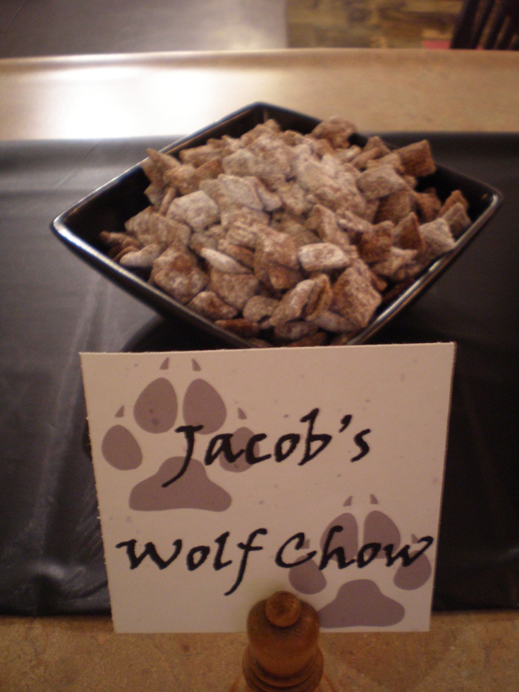 a sign that says jacob's wolf chow next to a bowl of dog food