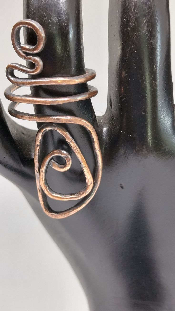 Hand-crafted adjustable ring made out of copper and dipped in liver of sulfur. Unique Open Ring In Bronze, Unique Bronze Open Ring, Adjustable Bronze Open Ring, Adjustable Bronze Metal Ring, Handmade Copper Spiral Rings, Artisan Hand Cast Adjustable Ring, Unique Bronze Copper Rings, Handmade Bronze Open Ring, Handmade Adjustable Bronze Rings