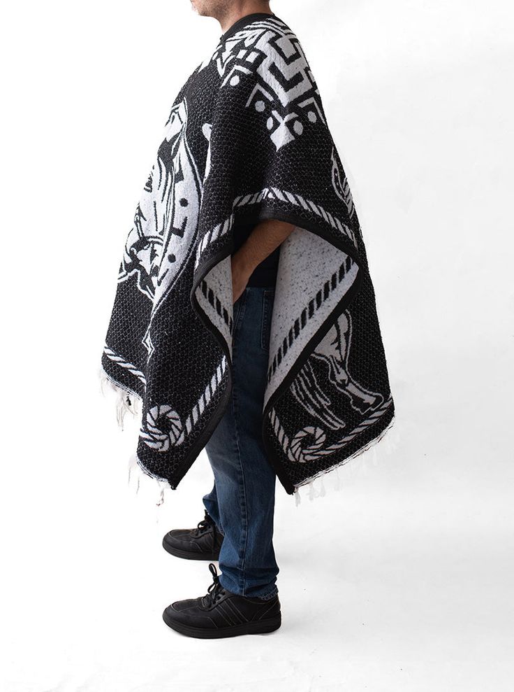 Material: Acrylic WoolColor: BlackStyle: Two HorsesSize:Length: 192cm (75")Width: 112 cm (44")It refers to the total measurements of the poncho when it is fully open (like a blanket). Description: MEXICAN PONCHO Genuine Mexican Poncho for Men manufactured in Mexico. The Mexican Poncho is an iconic and versatile garment that has been part of Mexican culture and tradition for centuries. The colorful and artisanal designs of GAMBOA adult ponchos make them a garment that not only expresses Mexican i Black Bohemian Poncho One Size, Black Cape For Fall Festivals, Black Fall Festival Cape, Black Oversized Outerwear For Festivals, Black Bohemian Cape For Festivals, Bohemian Black Cape For Festival, Black Bohemian Poncho Shawl, Black Shawl Cape For Festival, One Size Black Cape For Festival