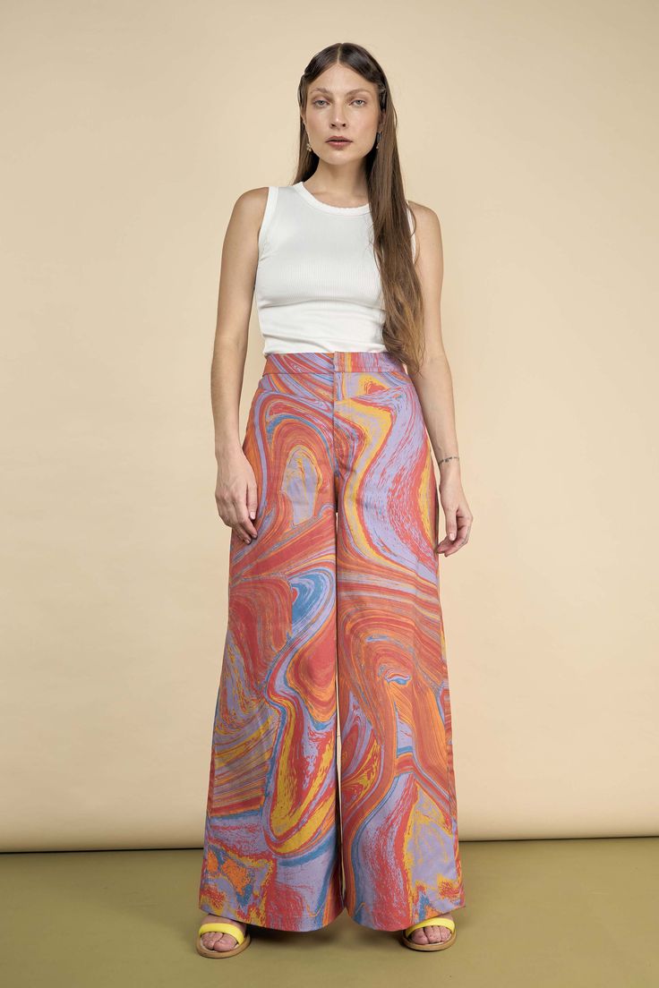 By combining these colors, you evoke a tropical vibe that the name reflects perfectly. Flow effortlessly in these pants, radiating warm and vibrant energy. Let your surroundings be inspired by your look and love your style. These pants are designed for you to admire yourself in the mirror and feel proud, ensuring that whenever you catch a glimpse of your reflection, you see just how stunning you truly are! Straight cut | High rise Trendy Multicolor Flare Bottoms, Casual Multicolor Flare Bottoms, High Waist Retro Summer Bottoms, Summer Relaxed Fit Flare Pants, Summer Flare Relaxed Fit Pants, Vibrant Fitted Wide Leg Pants, Relaxed Fit Flared Summer Pants, Multicolor Flare Cotton Bottoms, Multicolor Cotton Flare Bottoms