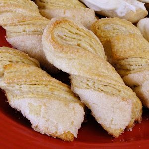 several pastries are arranged on a red plate