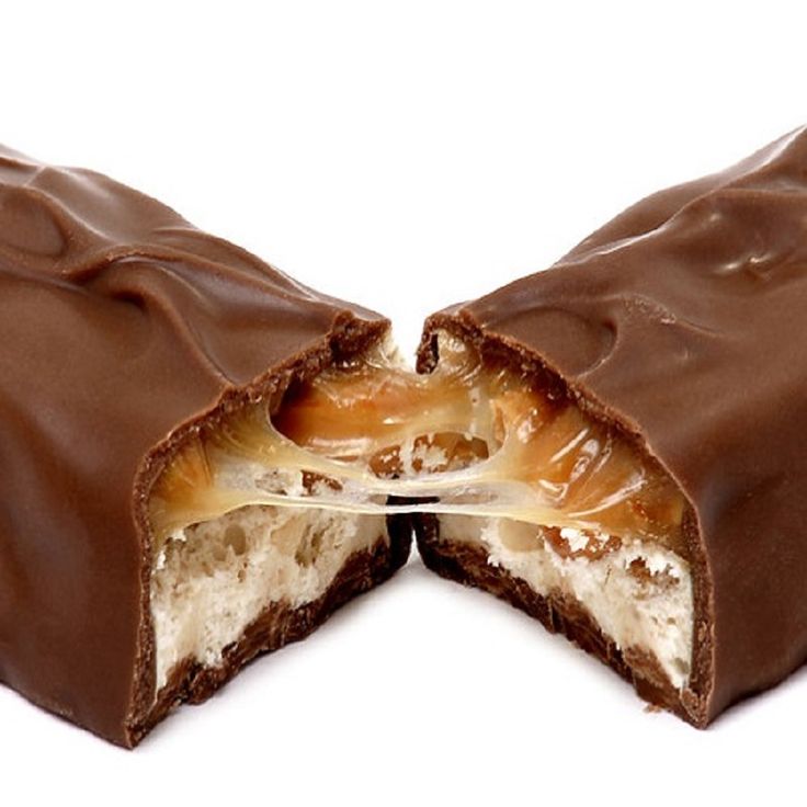 two pieces of chocolate covered with white and brown icing