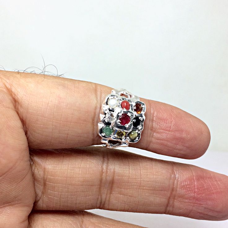 Genuine 925 Sterling Silver Navratan Ring Gemstone - Ruby , Emerald , Blue Sapphire, Yellow Sapphire, Hessonite, Cats Eye, Coral, Pearl, Cubic Zircona. Ring Size - QTY - 1 piece in this listing. The navratna or nine gems influencing the nine planets are: Ruby = Sun , Pearl = Moon, Red Coral = Mars, Emerald = Mercury, Yellow Sapphire = Jupiter, zircon = Venus, Blue Sapphire = Saturn, Hessonite = Rahu , Cat''s Eye = Ketu . Spiritual Sterling Silver Rings With Accent Stones, Spiritual Silver Rings With Accent Stones, Spiritual Sterling Silver Multi-stone Rings, Spiritual Multi-stone Sterling Silver Rings, Sterling Silver Multi-stone Emerald Promise Ring, Multicolor Sterling Silver Fine Jewelry Gemstones, Silver Spiritual Birthstone Ring With Accent Stones, Multicolor Sterling Silver Spiritual Rings, Spiritual Silver Birthstone Ring With Accent Stones