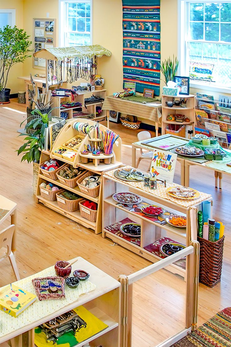 the inside of a children's playroom with lots of toys and books on shelves