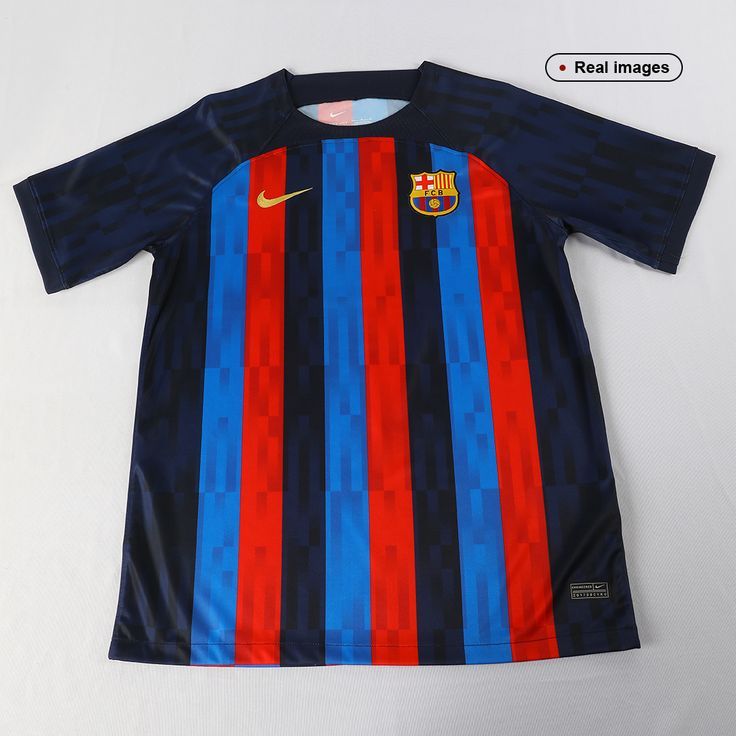 the nike barcelona home shirt is displayed on a white surface with red, blue and black stripes