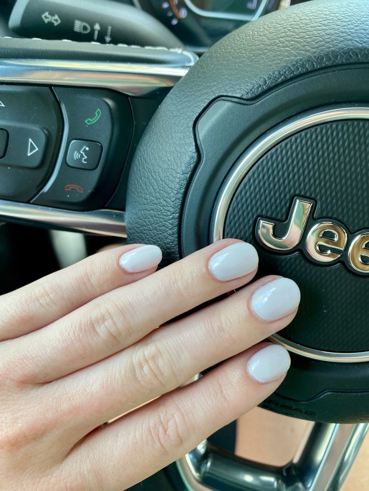 Pinkish white gel nail manicure hands over jeep steering wheel Short Bridesmaid Nail Ideas, Short White Round Nails, Extra Short Round Nails, Short Round Nails Spring, Super Short Round Nails, Short Round Spring Nails, Short Round Acrylic Nails Summer, Short Square Round Nails, Very Short Round Nails