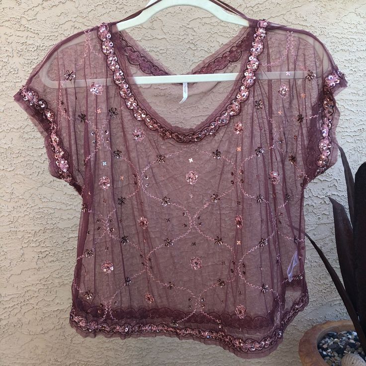 Rust-Colored Sheer Blouse. Has Sequin And Bead Detailing, Perfect To Pair With Black Jeans And Booties! No Tags But Never Worn, No Flaws! *Measurements Available Upon Request* Bohemian Sequin Tops For Night Out, Beaded Short Sleeve Top For Party, Bohemian Beaded Tops For Night Out, Beaded Short Sleeve Tops For Evening, Bohemian Pink Tops For Party, Pink Bohemian Party Tops, Elegant V-neck Tops For Festivals, Beaded Tops For Night Out In Spring, Beaded Top For Spring Party