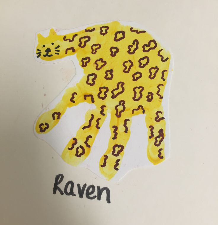 a paper cut out of a cat with the word raven written on it