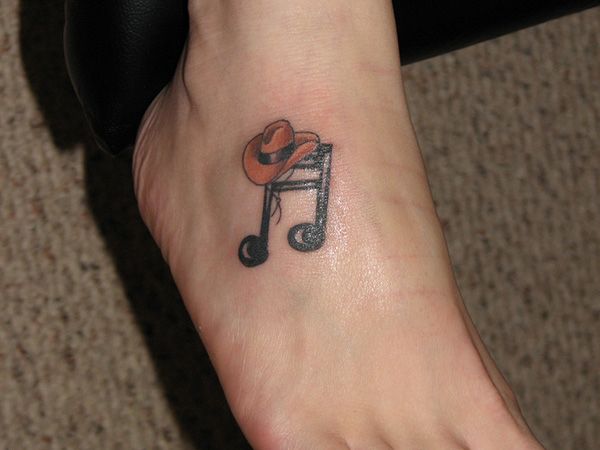 a person with a small tattoo on their foot