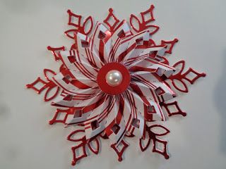 a red and white snowflake on the wall