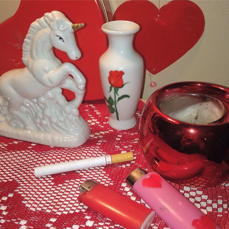 a table topped with white vases and other items