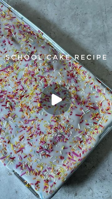 an apple laptop covered in sprinkles with the words school cake recipe on it