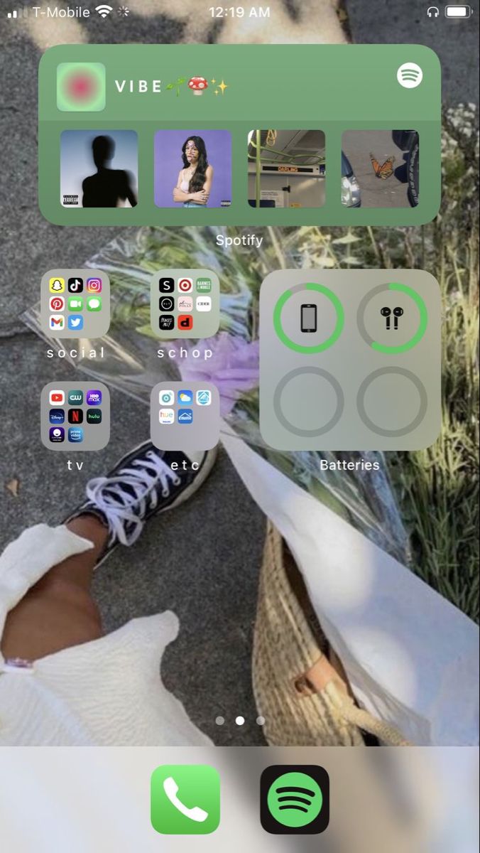 an iphone screen showing the view of someone's feet and their shoes with different icons on them