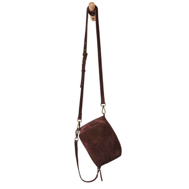 Out of The Box Crossbody Elevate your style with our Out of The Box Crossbody. Crafted from luxurious suede, this stunning bag adds shape and texture to any look. The roomy center pocket and adjustable straps make it perfect for any occasion. Experience unparalleled versatility and sophistication with this must-have accessory. Suede Shoulder Bag With Adjustable Strap For On-the-go, Modern Suede Shoulder Bag With Adjustable Strap, Versatile Rectangular Suede Bag, Suede Bag With Adjustable Strap For On-the-go, On-the-go Suede Shoulder Bag With Adjustable Strap, Versatile Suede Shoulder Bag With Adjustable Strap, Suede Crossbody Shoulder Bag With Detachable Strap, Chic Crossbody Bag With Suede Lining, Suede Crossbody Shoulder Bag With Adjustable Strap