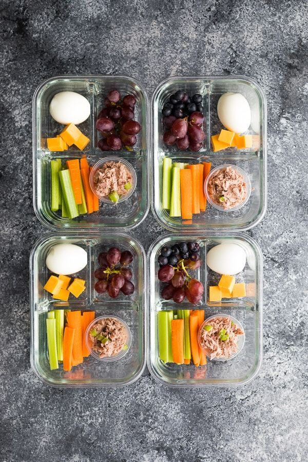 four glass containers filled with different types of food and the text tuna protein box gf 27