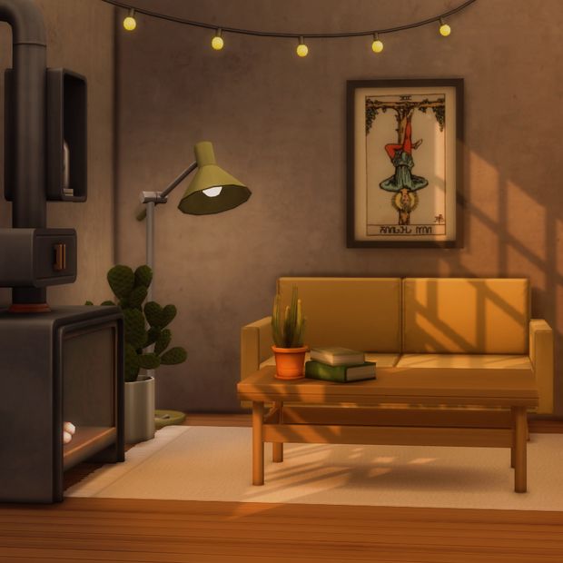 a living room with a couch, table and lamp