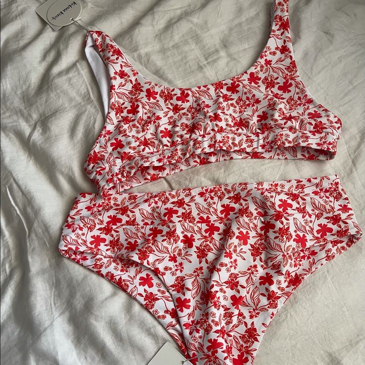 Super Cute Scarlette Print Features Bold Red Florals That Come To Life On A White Background, Cropped Top Style And Cheeky Bottoms. The Tag Says 3xl But Fits Like An Xl Because It’s Australian Size. It’s Band New Tag And Sticker Still On Will Be Packed In Original Package Red Stretch Summer Tankini, Red Stretch Tankini For Spring, Red Tankini For Spring Vacation, Red Tankini For Vacation In Spring, Red Summer Tankini, Red Floral Print Swimwear For Beach Party, Red Summer Swimwear For Poolside, Red Sleeveless Swimwear For Beach Party, Red Floral Print Sleeveless Swimwear