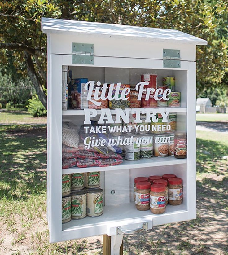 a sign that says little free pantry take what you need give what you can on it