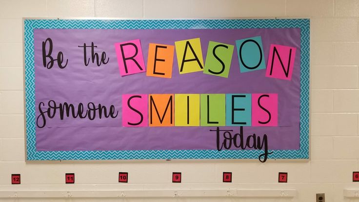 a bulletin board with the words be the reason someone smiles today written in multicolored letters