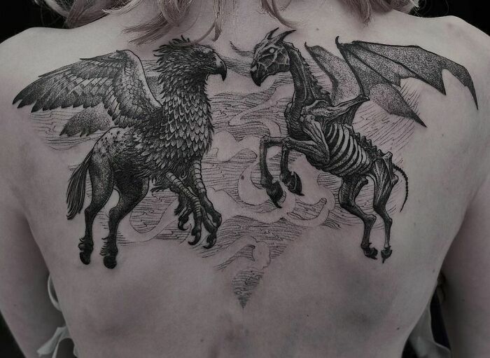 the back of a woman's chest with two horses and a skeleton on it