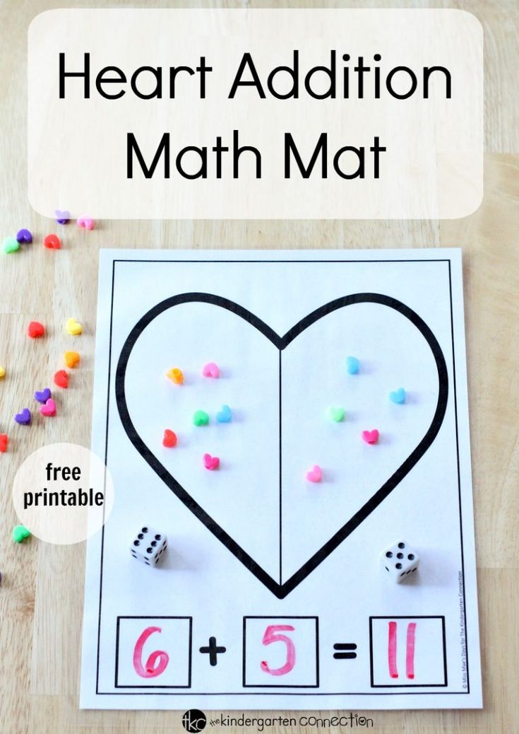 a heart addition math mat with dices on it